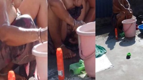 Dehati Bhabhi bathing topless on the terrace