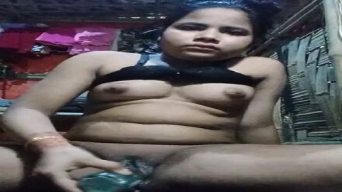 Horny village girl masturbating with bottle
