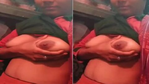 Cute Indian college girl holding her soft boobs