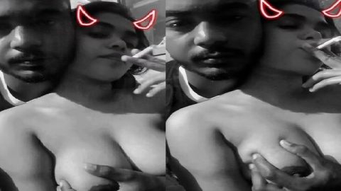 Girlfriend smoking cigarette with boob press