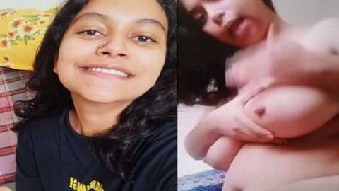 Smiling girl nude playing with big boobs and pussy