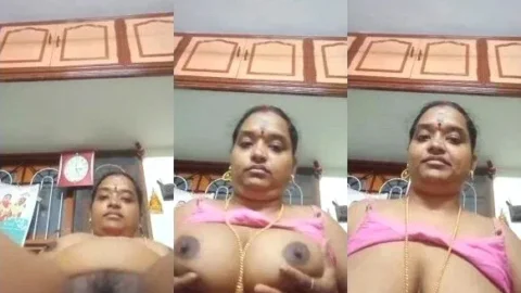 Leaked Tamil Aunty Nude Show Squeezing Her Massive Boobs And Hard Nipples Video MMS